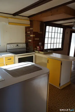 a view of a kitchen with a window