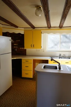a kitchen that has a sink and a stove