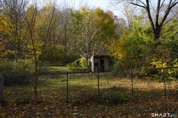 a backyard of a house with lots of green space