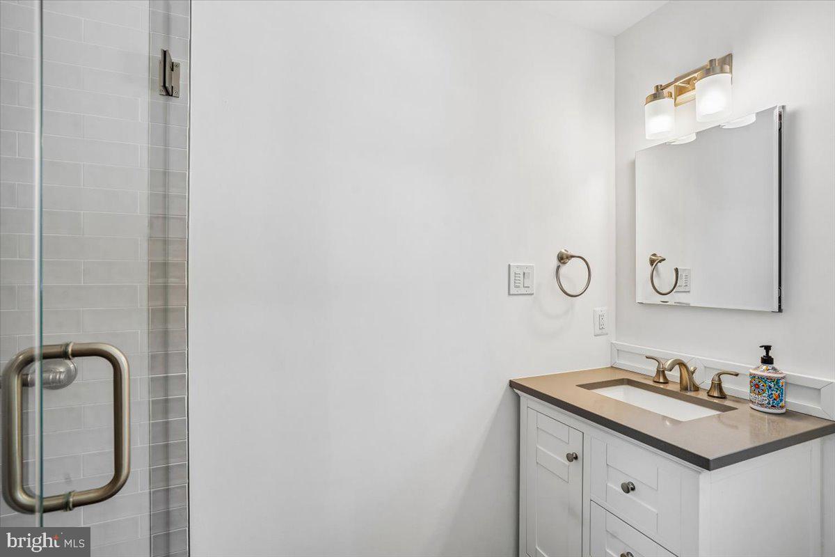 6904 Chelsea Road McLean, VA 22101 - Photo 7 of 15 Sleek modern bathroom with elegant fixtures.