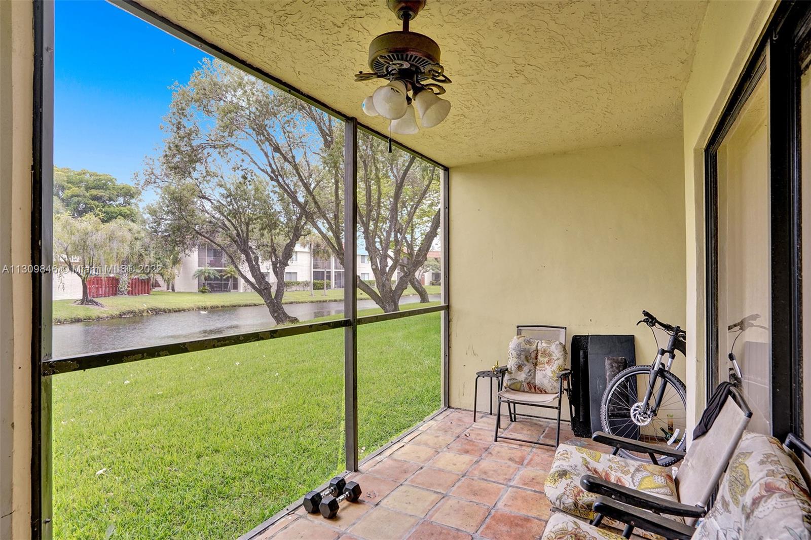 491 Racquet Club Road, Unit 101 Weston, FL 33326 - Photo 25 of 32 a view of a balcony with furniture