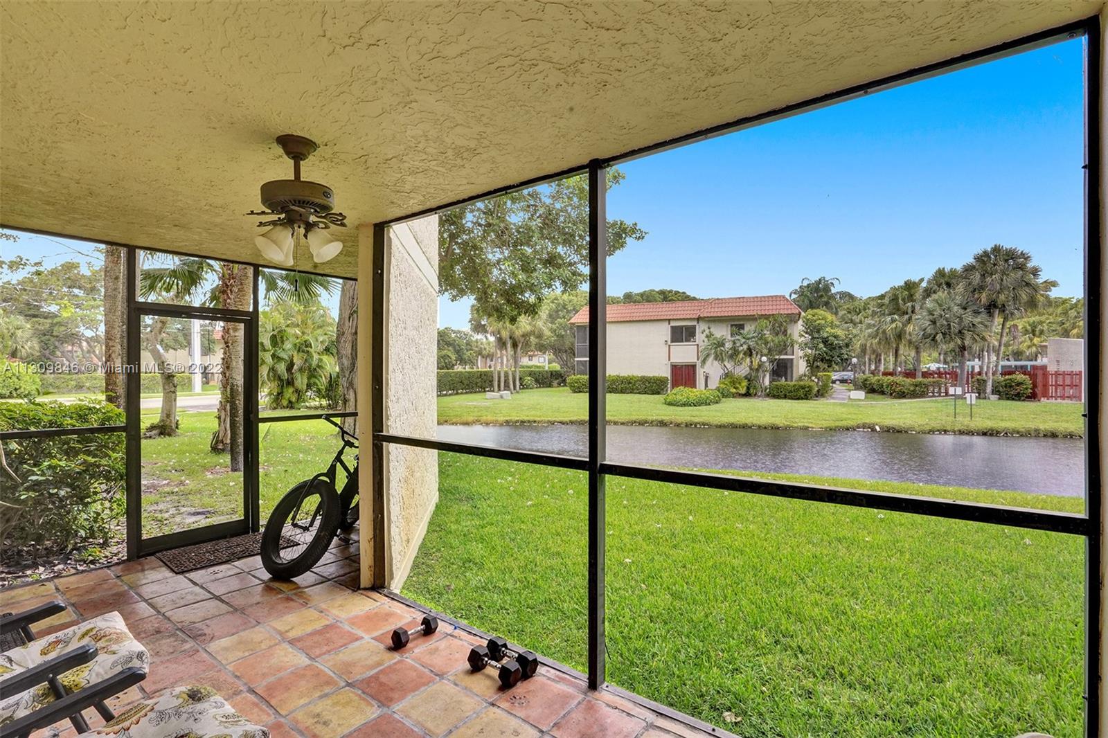 491 Racquet Club Road, Unit 101 Weston, FL 33326 - Photo 3 of 32 a view of swimming pool from a balcony