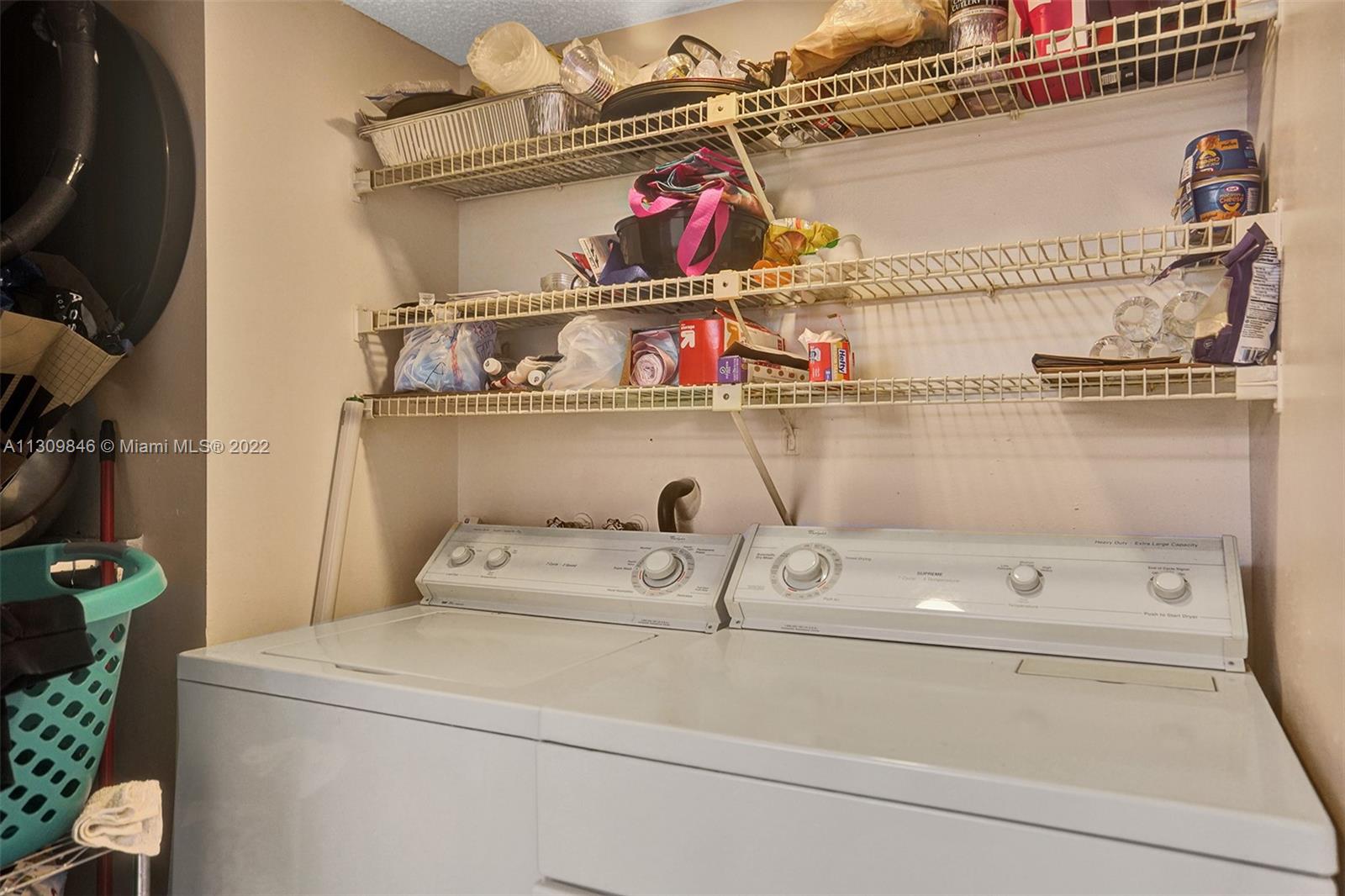 491 Racquet Club Road, Unit 101 Weston, FL 33326 - Photo 9 of 32 a utility room with washer and dryer