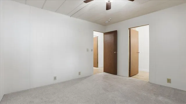 an empty room with fan