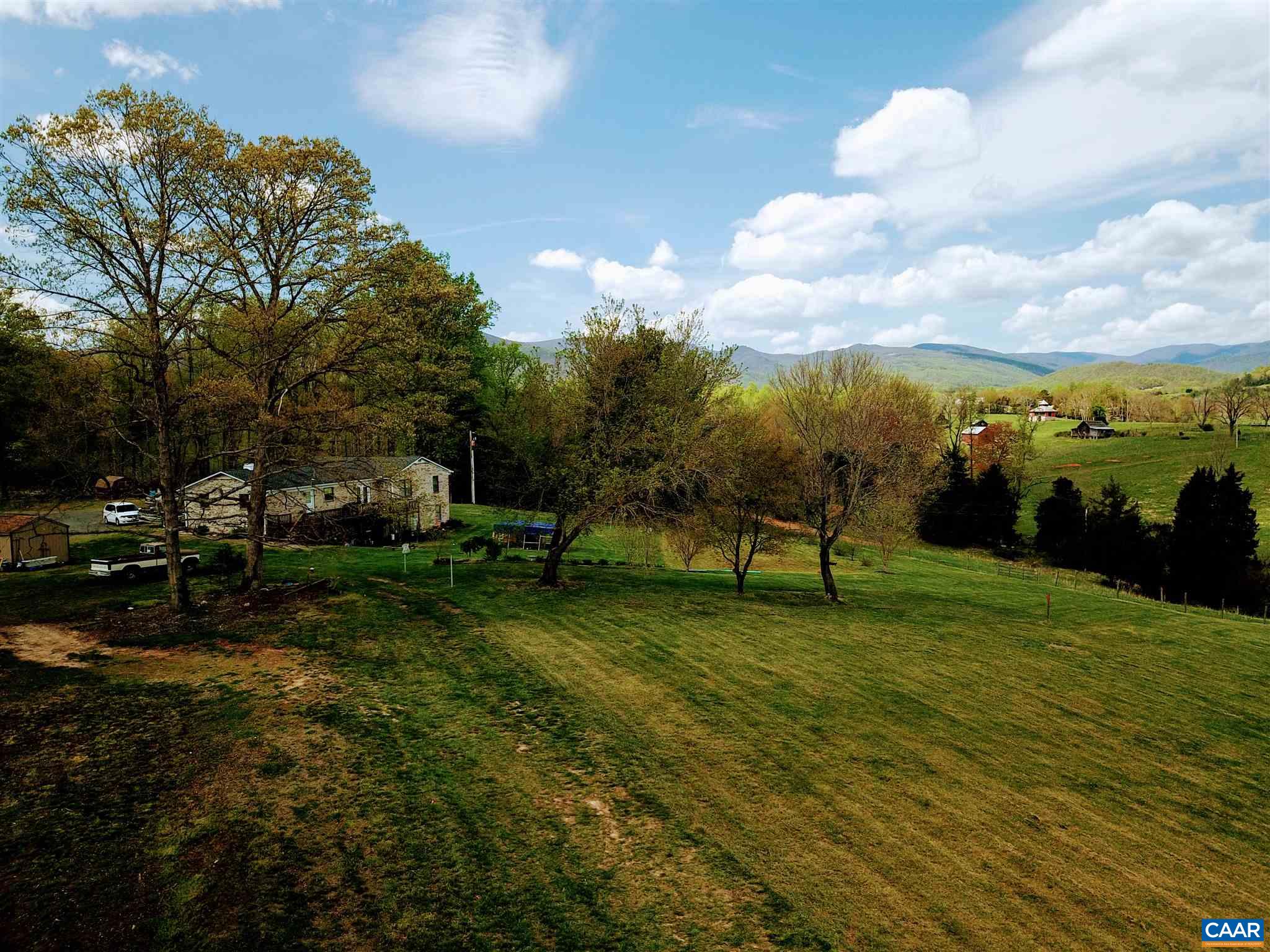 Tba Octonia Road Stanardsville, VA 22973 - Photo 14 of 42 a view of a golf course with a lake