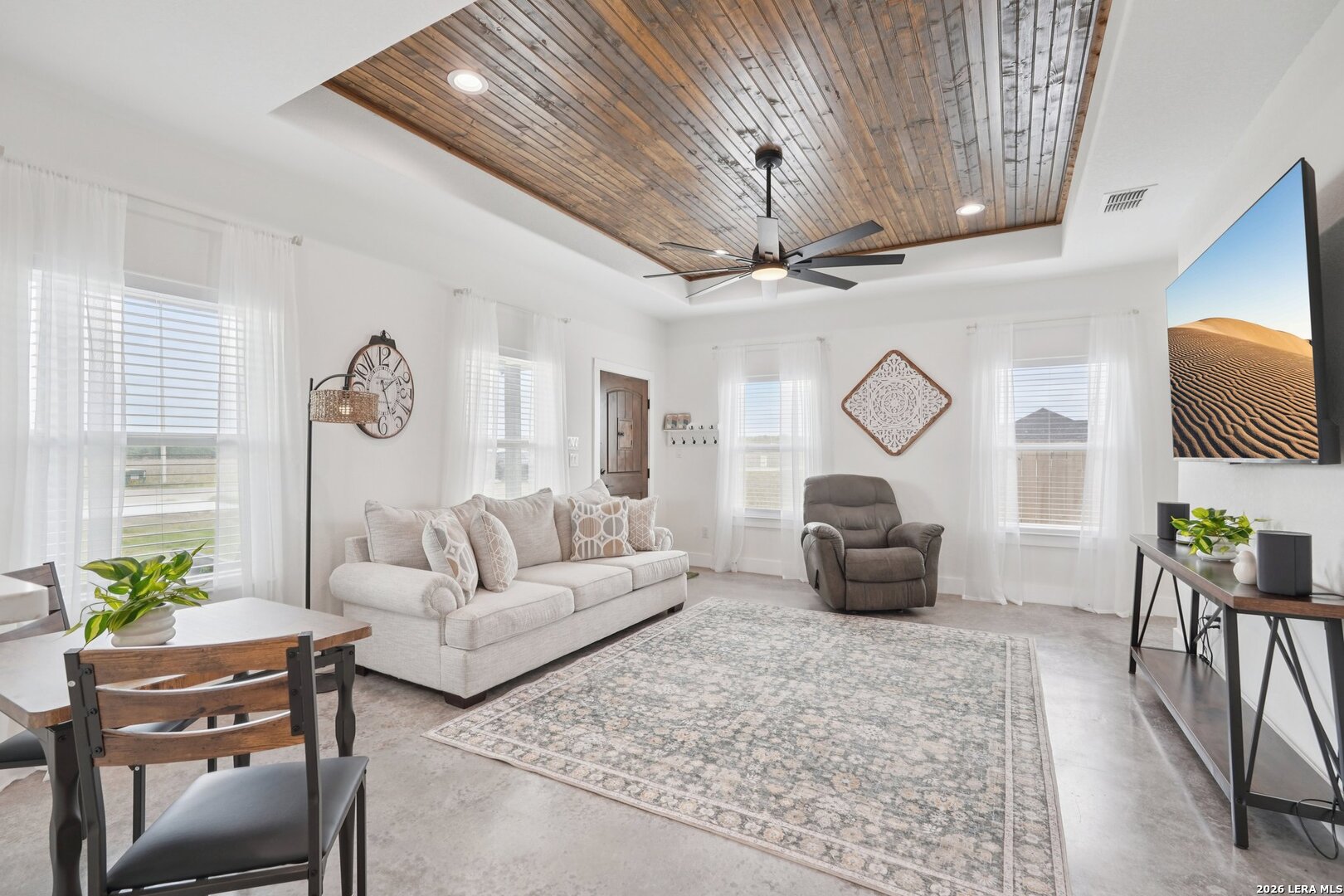 218 Colonial Lane La Vernia, TX 78121 - Photo 14 of 46 a living room with furniture a fireplace and a chandelier