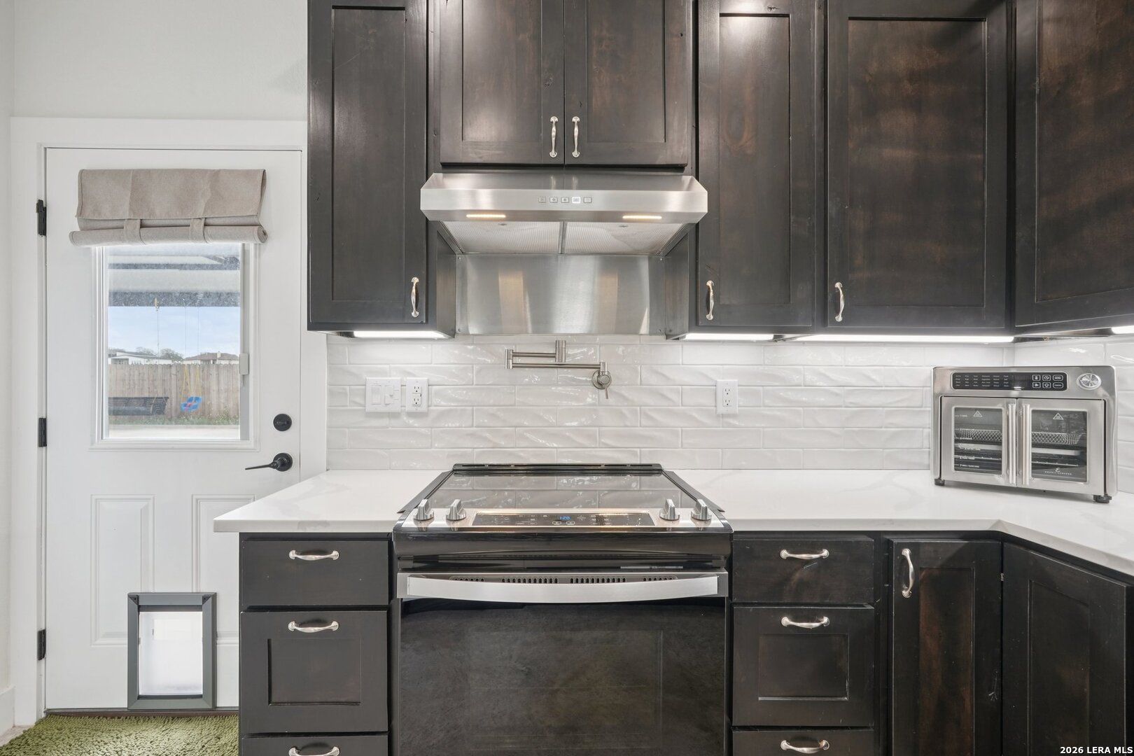 218 Colonial Lane La Vernia, TX 78121 - Photo 19 of 46 a kitchen with a stove and a sink