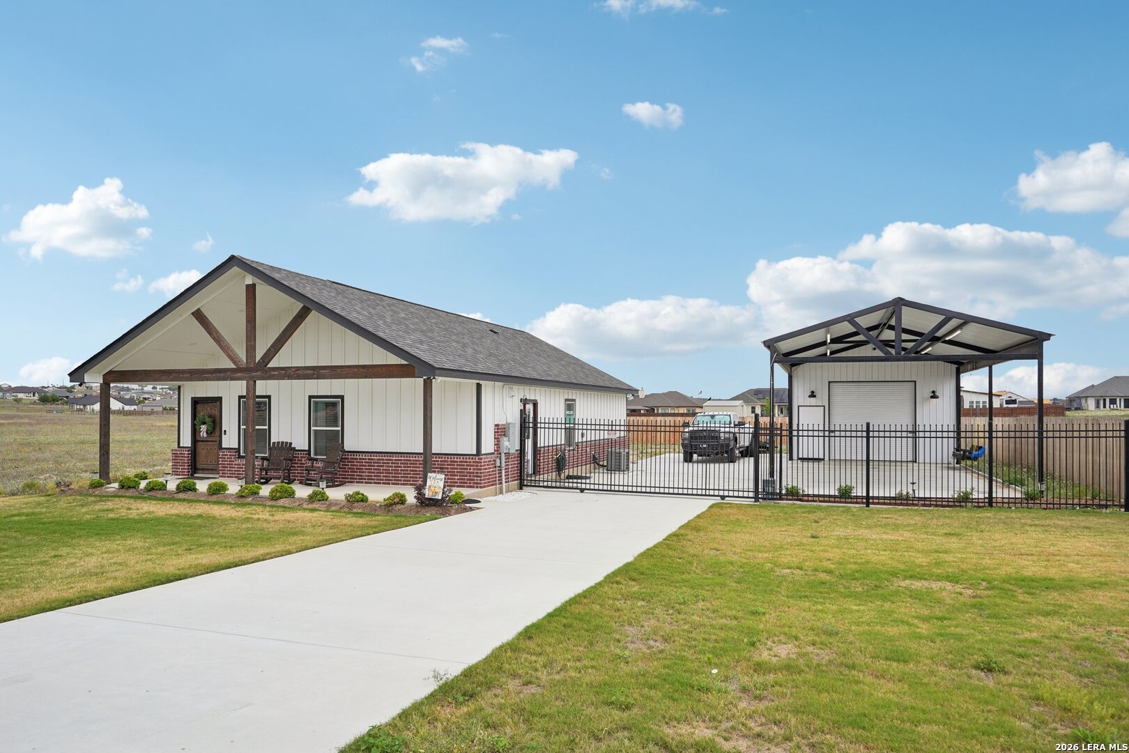 218 Colonial Lane La Vernia, TX 78121 - Photo 2 of 46 a view of a house with a big yard and large trees