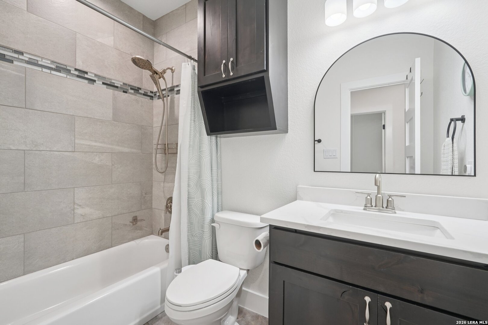 218 Colonial Lane La Vernia, TX 78121 - Photo 21 of 46 a bathroom with a sink a toilet a mirror and shower
