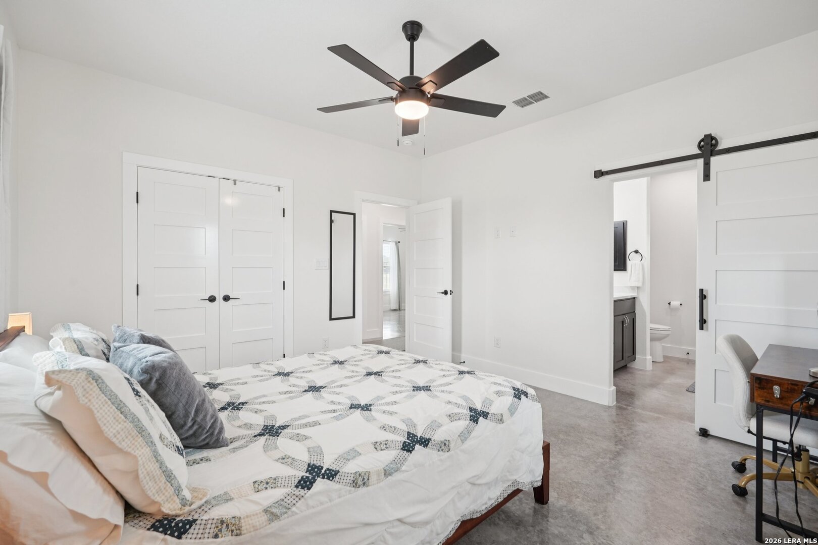 218 Colonial Lane La Vernia, TX 78121 - Photo 22 of 46 a bedroom with a bed and a ceiling fan