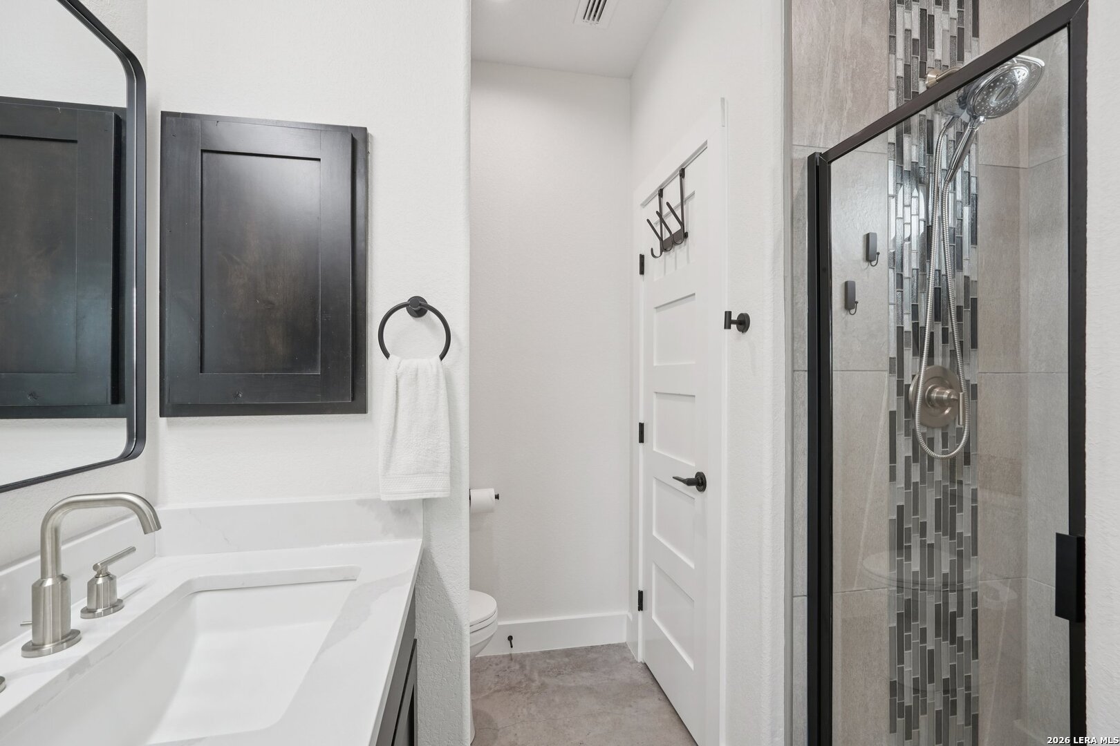 218 Colonial Lane La Vernia, TX 78121 - Photo 26 of 46 a bathroom with a sink a toilet and shower