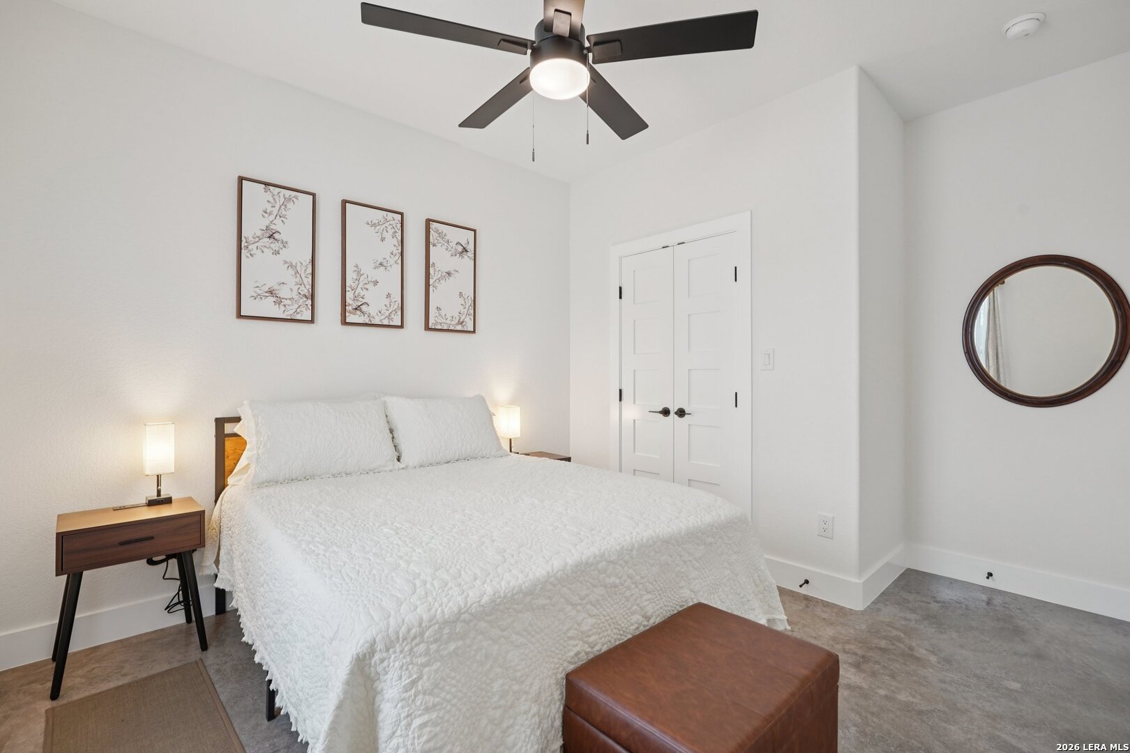 218 Colonial Lane La Vernia, TX 78121 - Photo 28 of 46 a bedroom with a bed and a lamp on the dresser