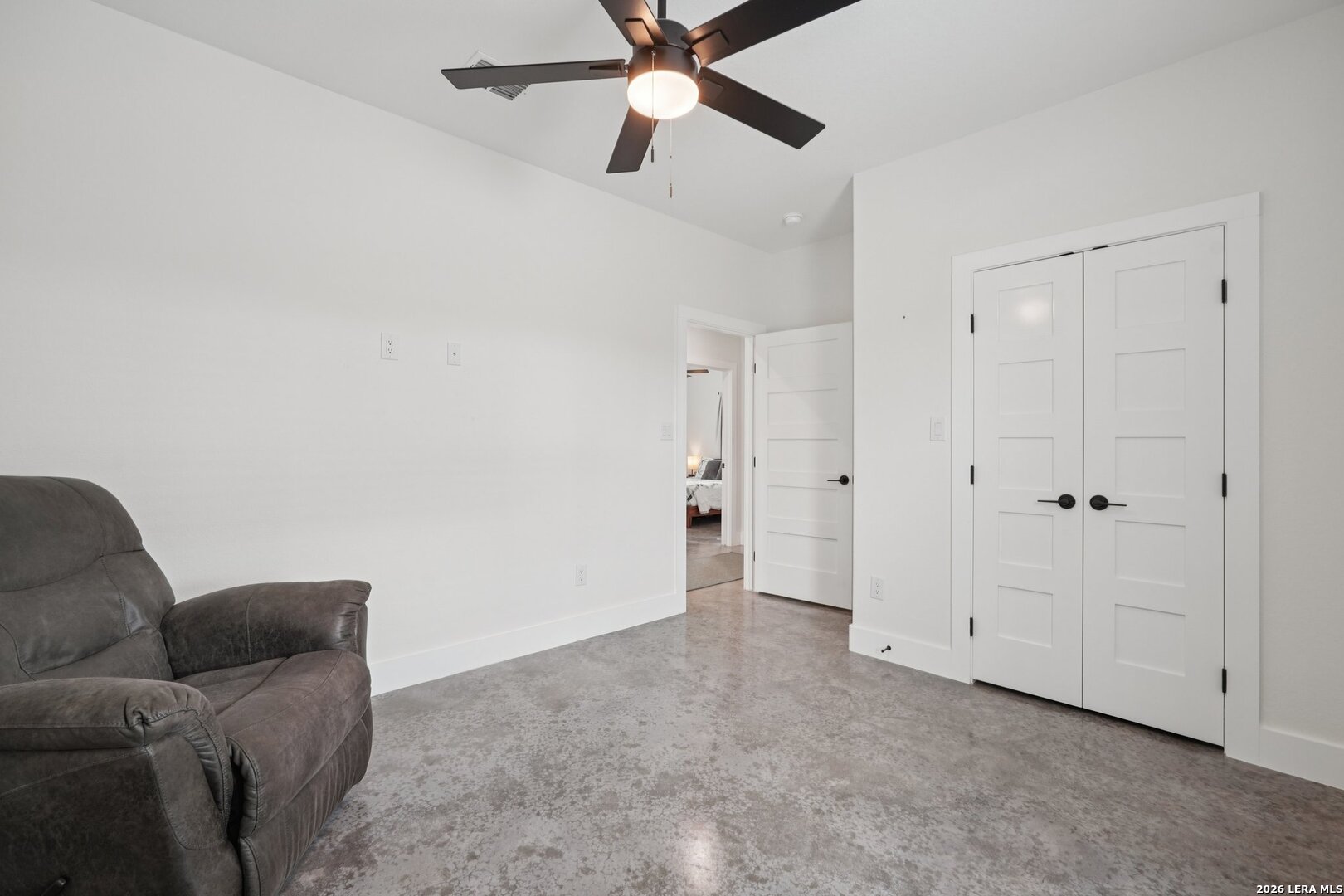 218 Colonial Lane La Vernia, TX 78121 - Photo 30 of 46 a living room with furniture and a ceiling fan