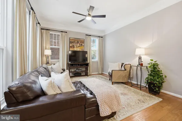 a bedroom with furniture and a flat screen tv