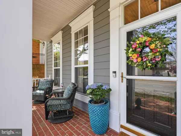 a balcony with furniture and flowers