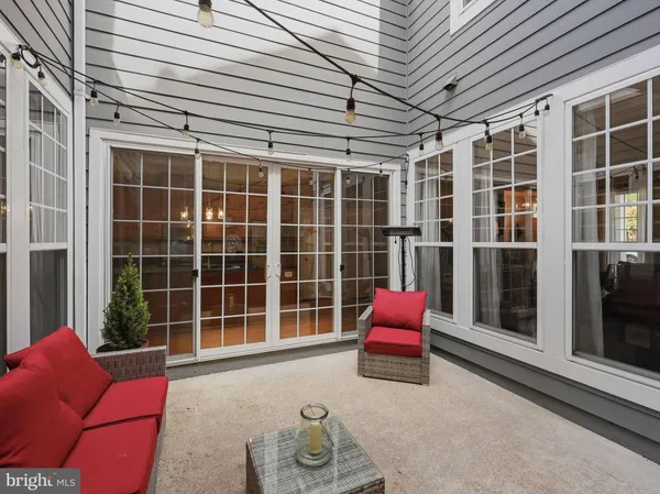 a view of a hallway with wooden floor and a floor to ceiling window