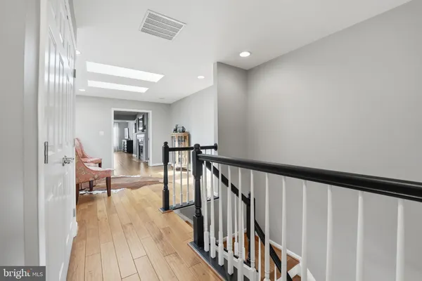 a view of a hallway with a hardwood floor