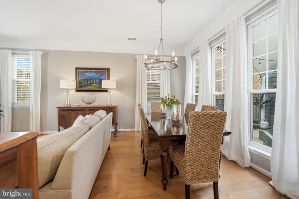 a dining room with furniture a livingroom and chandelier