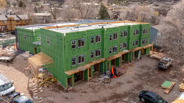 an aerial view of a house with outdoor space