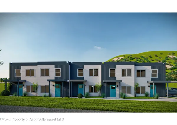 a view of a big house with a big yard and large trees
