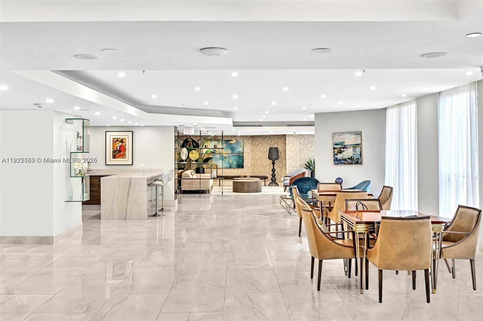 20191 East Country Club Drive, Unit 805 Aventura, FL 33180 - Photo 6 of 10 a living room with furniture and a table