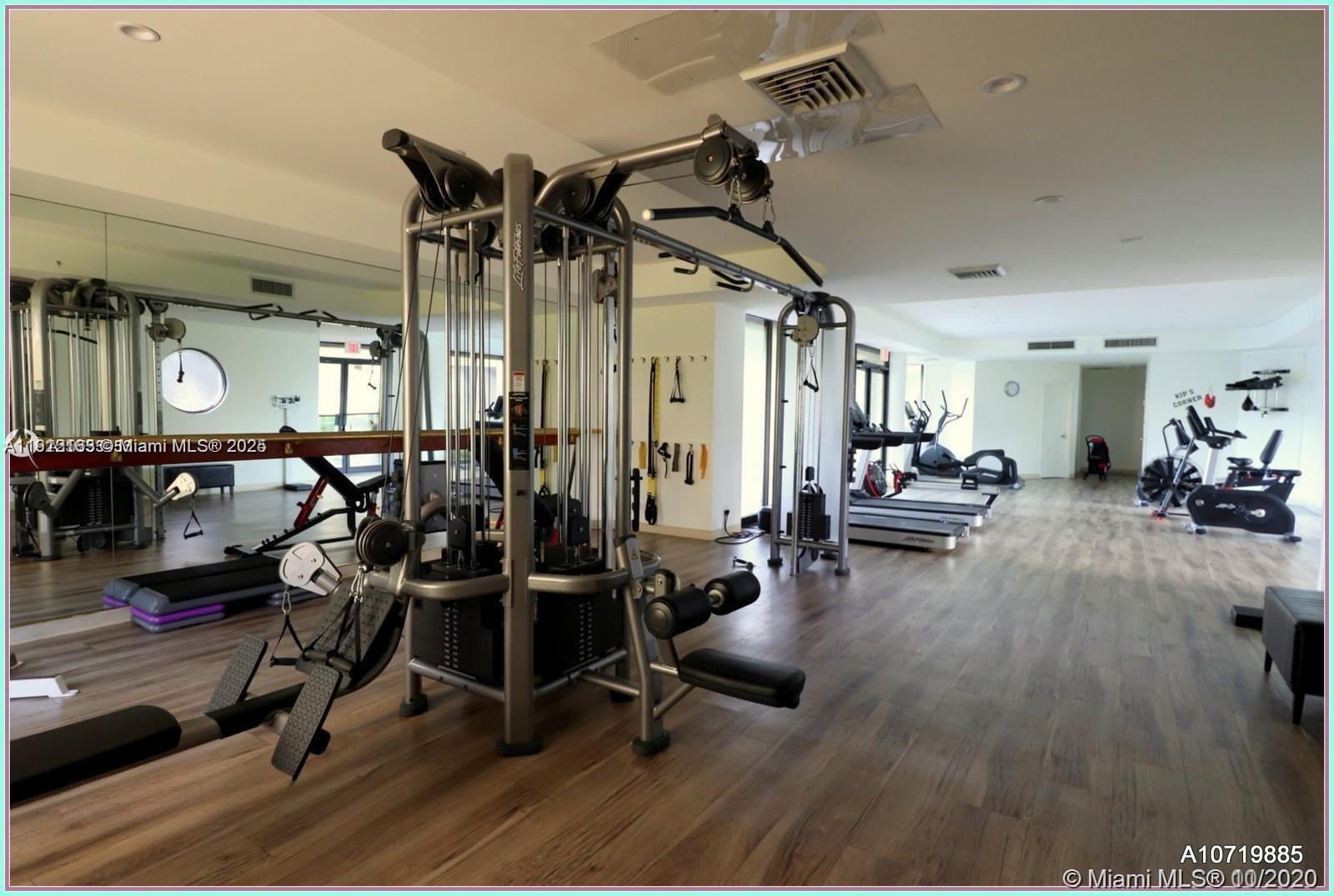 20191 East Country Club Drive, Unit 805 Aventura, FL 33180 - Photo 7 of 10 a view of a room with gym equipment