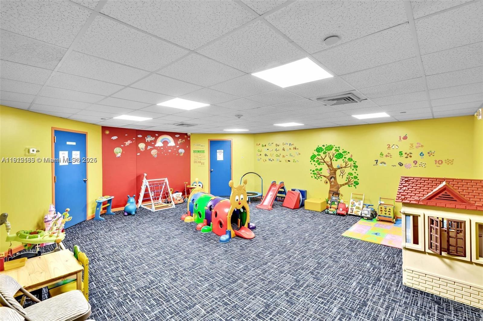 20191 East Country Club Drive, Unit 805 Aventura, FL 33180 - Photo 8 of 10 a room with lots of furniture and wooden floor