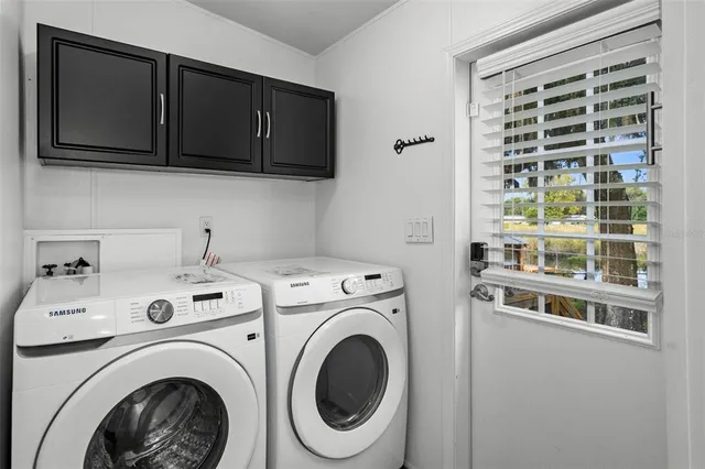 a bathroom with a granite countertop sink a mirror and shower
