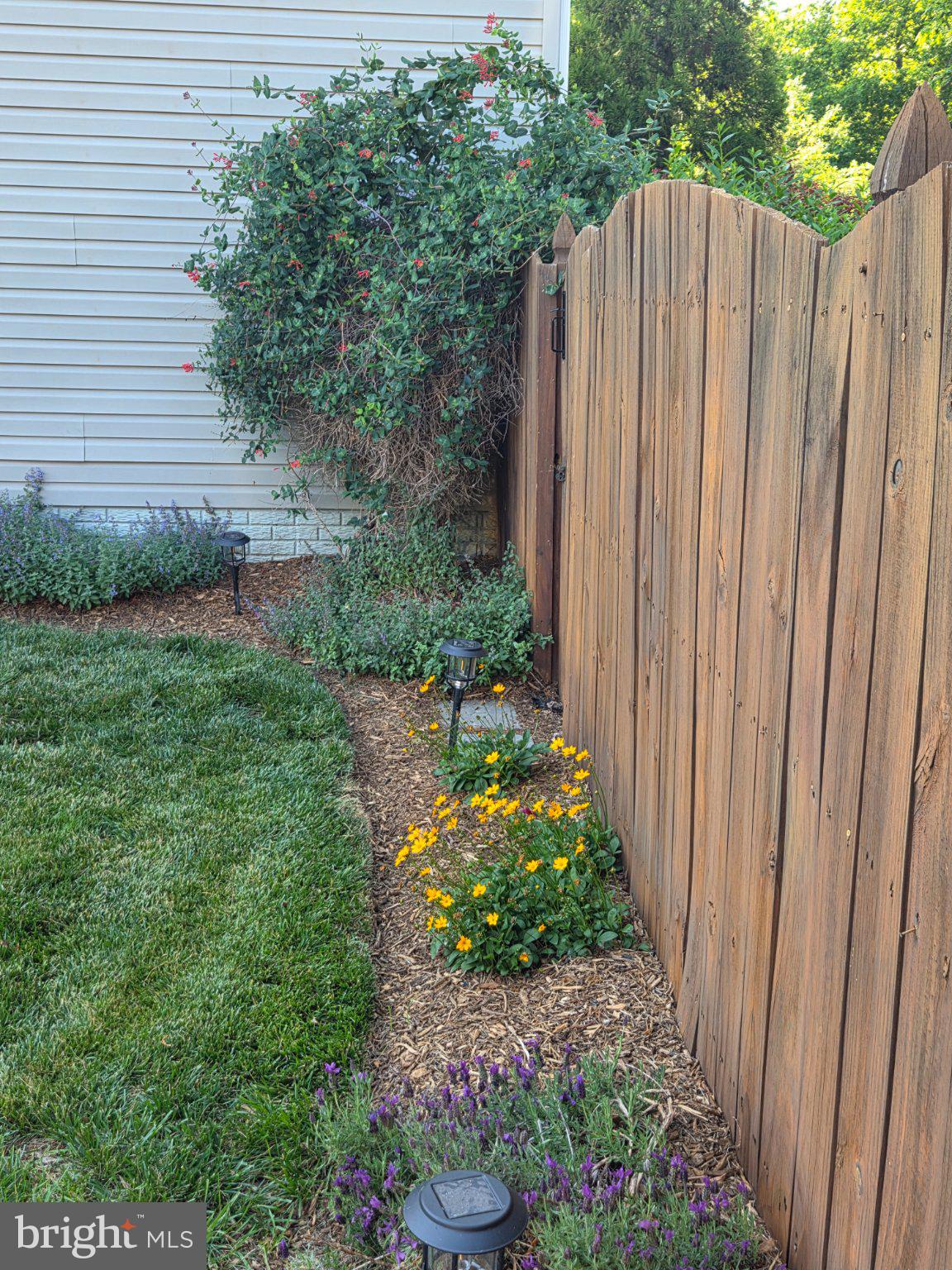 35175 Pheasant Ridge Road Locust Grove, VA 22508 - Photo 59 of 80 Charming garden by a rustic fence.
