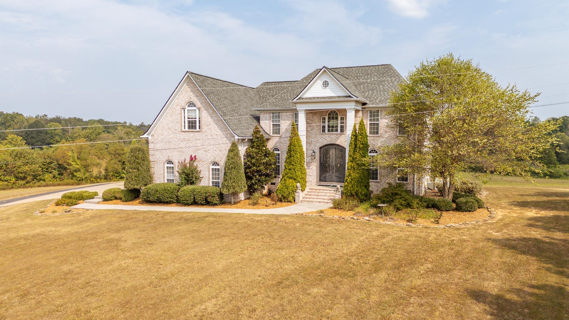 5166 Middlefork Road Luray, TN 38352 - Photo 1 of 40 a front view of a house with a yard