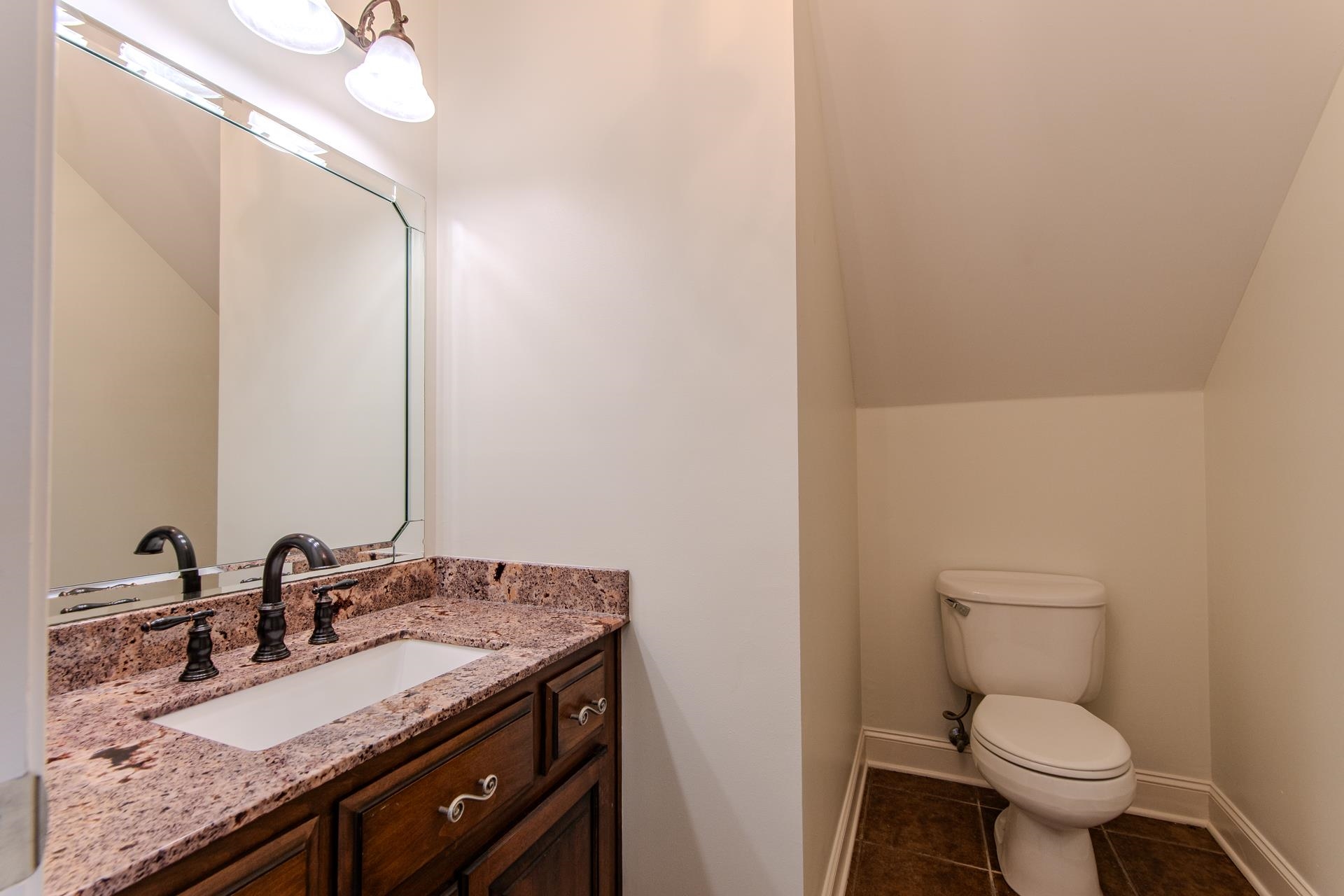 5166 Middlefork Road Luray, TN 38352 - Photo 17 of 40 a bathroom with a granite countertop sink toilet and a mirror