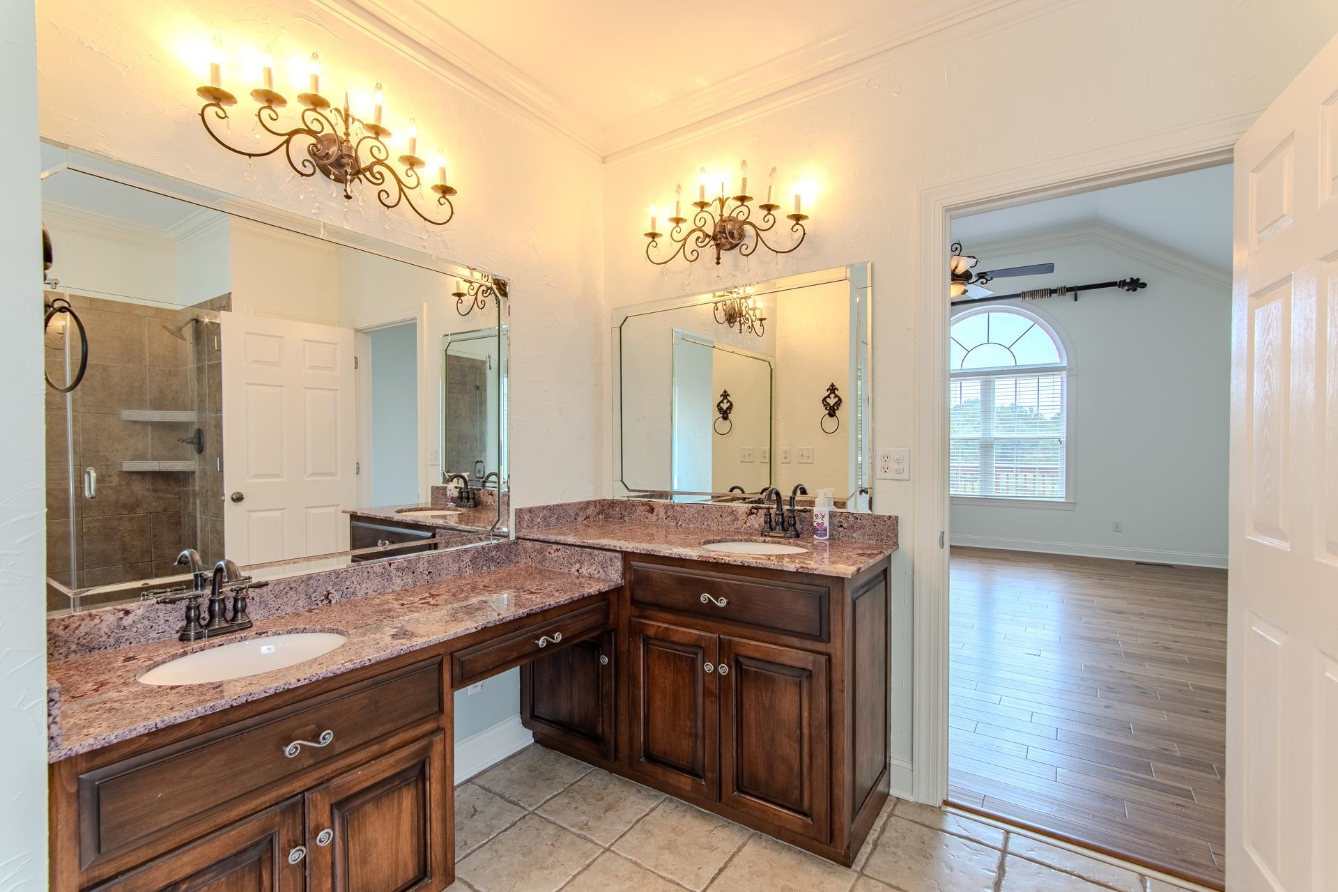 5166 Middlefork Road Luray, TN 38352 - Photo 20 of 40 a spacious bathroom with a granite countertop double vanity sink and a mirror