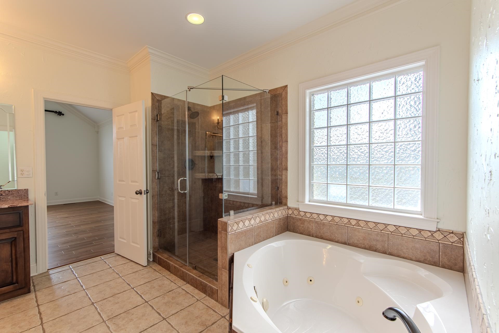 5166 Middlefork Road Luray, TN 38352 - Photo 21 of 40 a bathroom with a bathtub and a shower