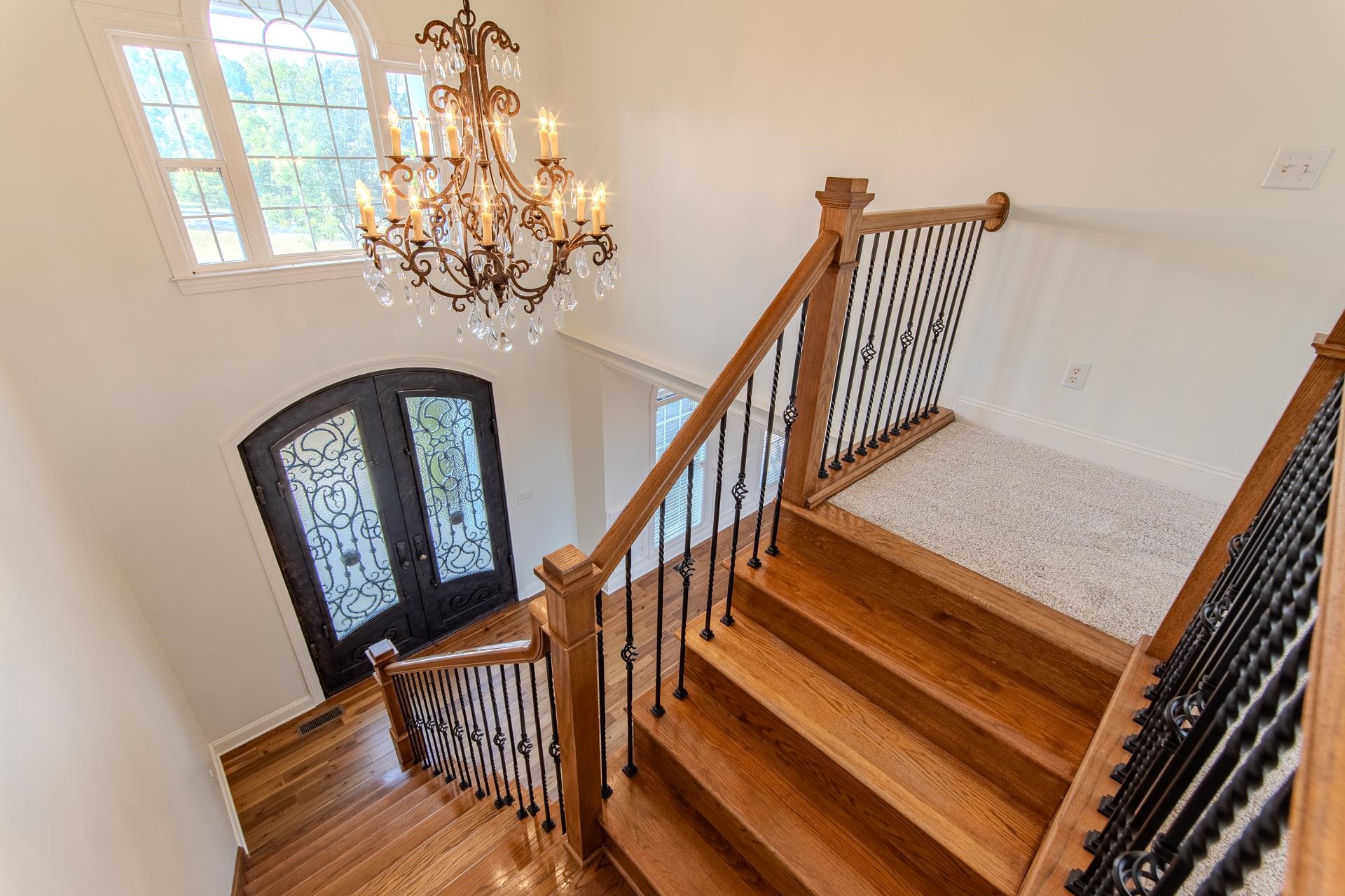 5166 Middlefork Road Luray, TN 38352 - Photo 24 of 40 a view of staircase with wooden floor and a potted plant