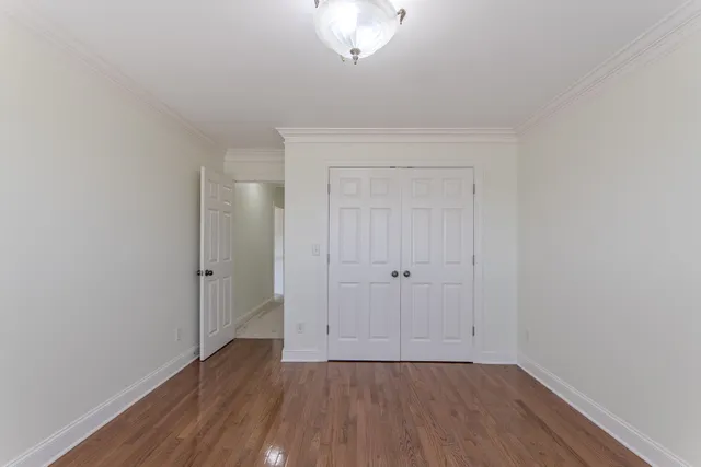a view of a room with wooden floor