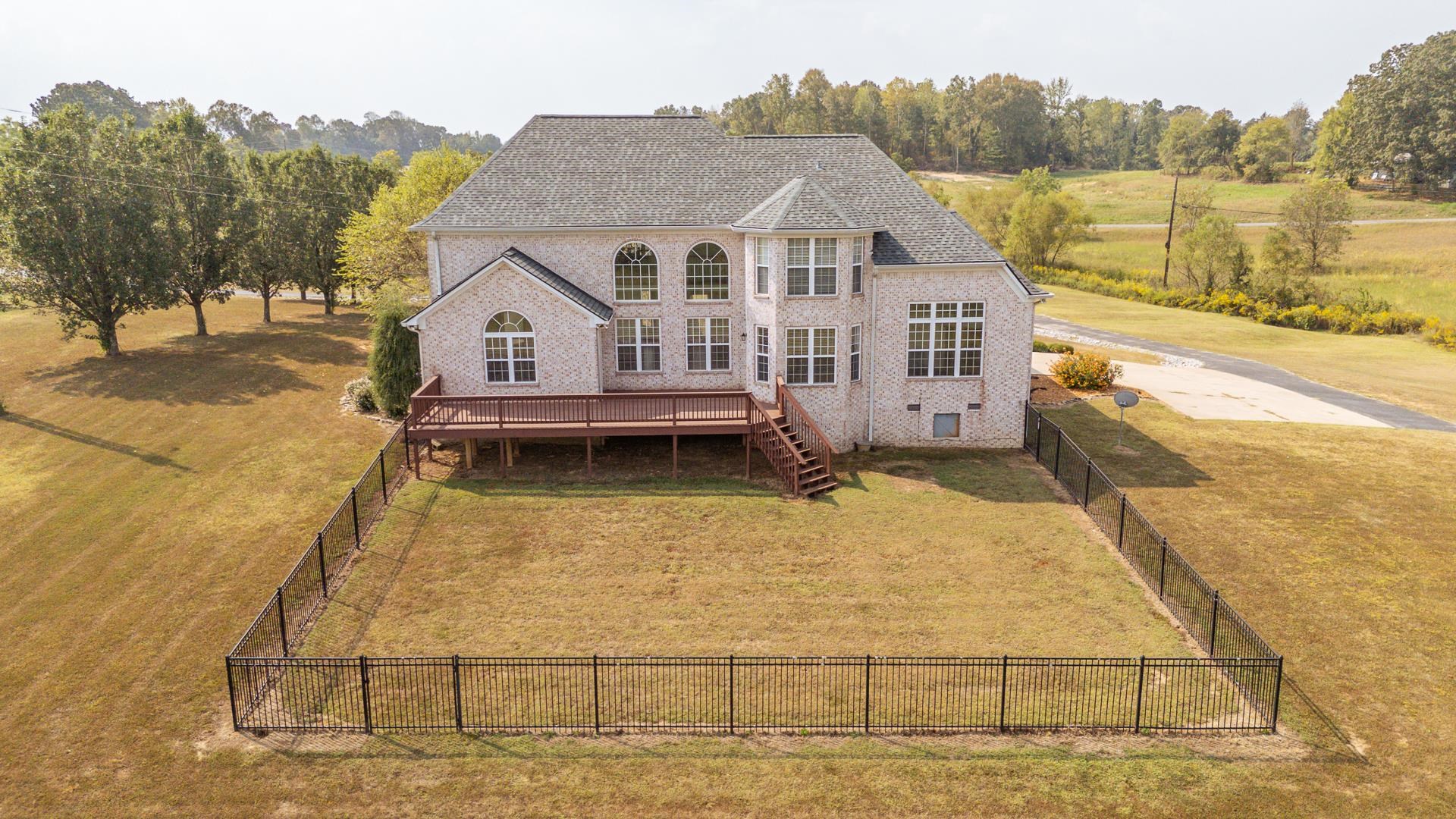 5166 Middlefork Road Luray, TN 38352 - Photo 38 of 40 a view of a house next to a lake with mountain