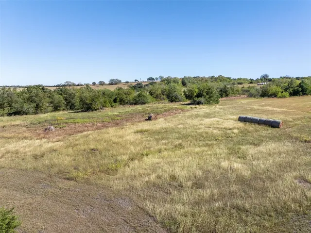a view of a lake in middle of forest