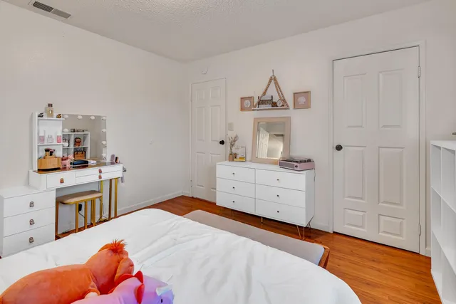 a bedroom with a bed and a cabinets