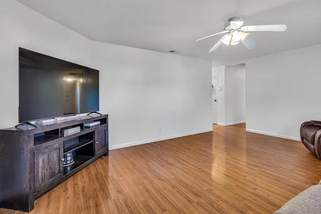a room with furniture and a flat screen tv
