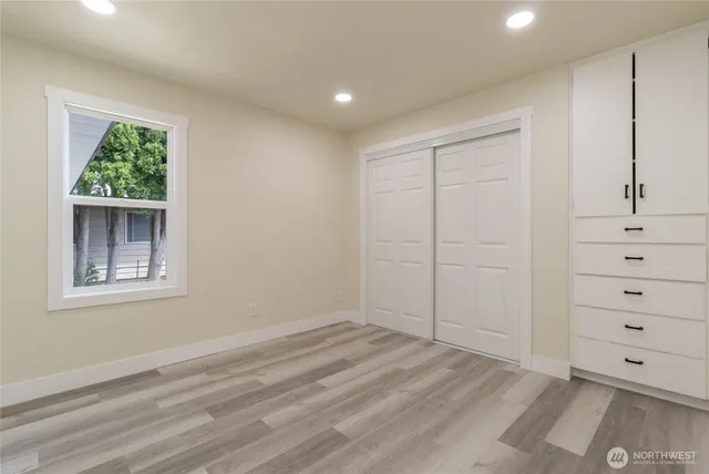 a view of a closet in white room