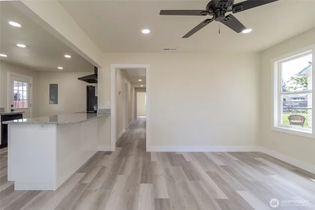 a view of a hallway with a window