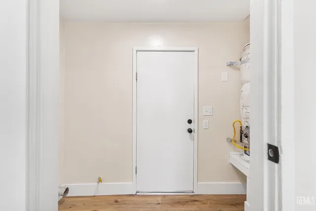 a bathroom with a granite countertop shower a mirror and a sink