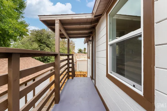 a kitchen with white cabinets appliances and a sink