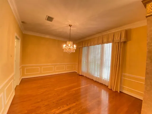 an empty room with a empty space and a window