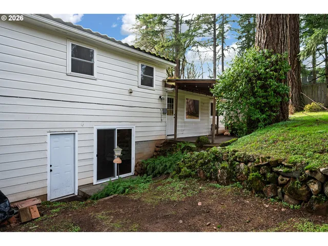 a view of a house with a yard and plants