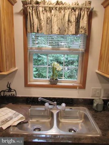 a kitchen with a sink and a window