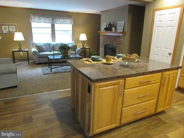 a view of a kitchen counter space and windows