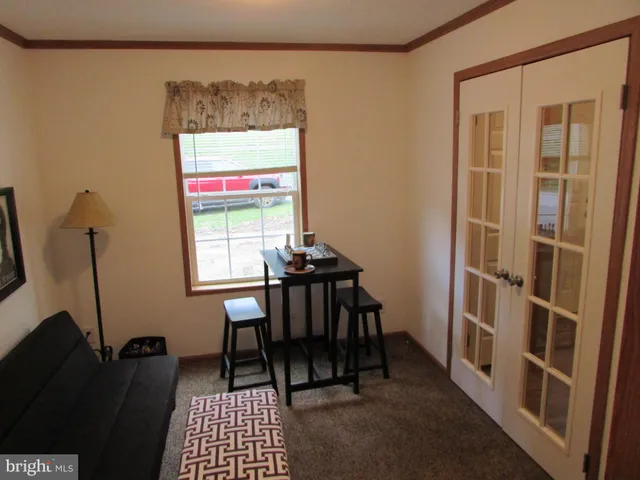 a view of a room with furniture and a window