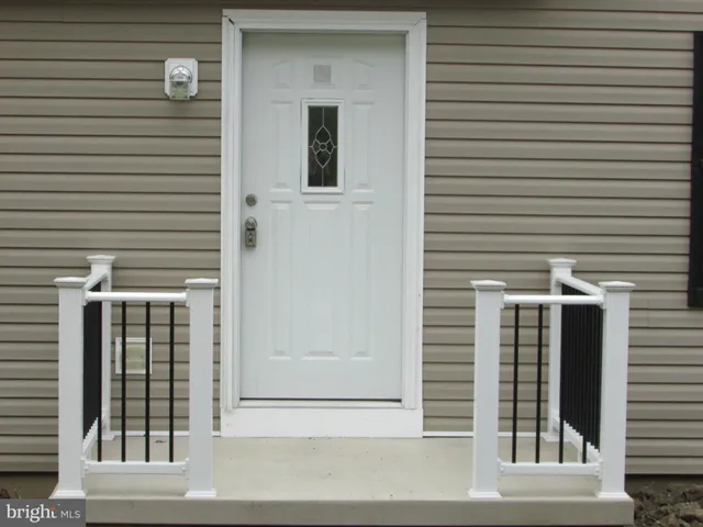 a view of a brick house with a large window