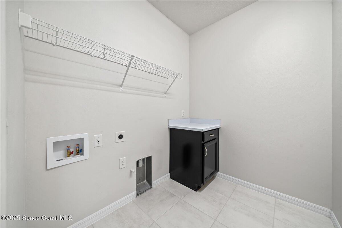 3245 Hummingbird Way Melbourne, FL 32940 - Photo 49 of 66 Upstairs laundry